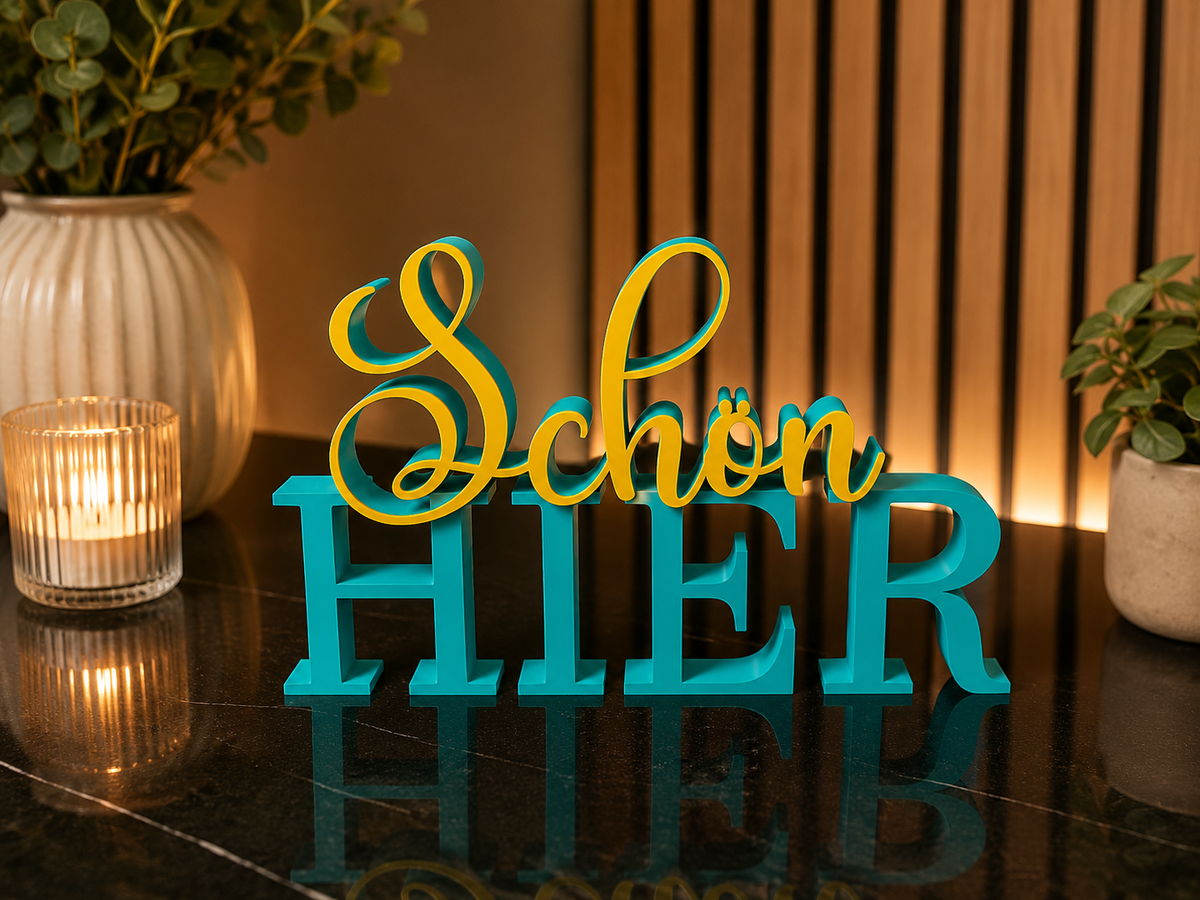 Schriftzug Schön hier – Türkis/Gelb
